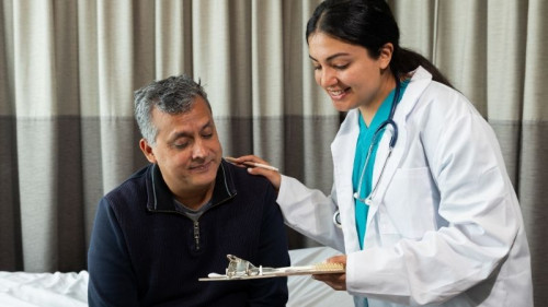 Doctor and patient at health checkup appointment.
