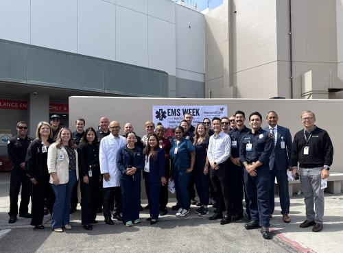 Care teams at Long Beach Medical Center and Miller Children’s & Women’s, along with executive leadership, board members, EMS personnel, Steven Costa, commander of the West Division of the Long Beach Police Department, and James Farley, deputy chief of operations with the Long Beach Fire Department, gather outside the ambulance entrance and trauma bay to celebrate the opening of the EMS lounge during National EMS Week.