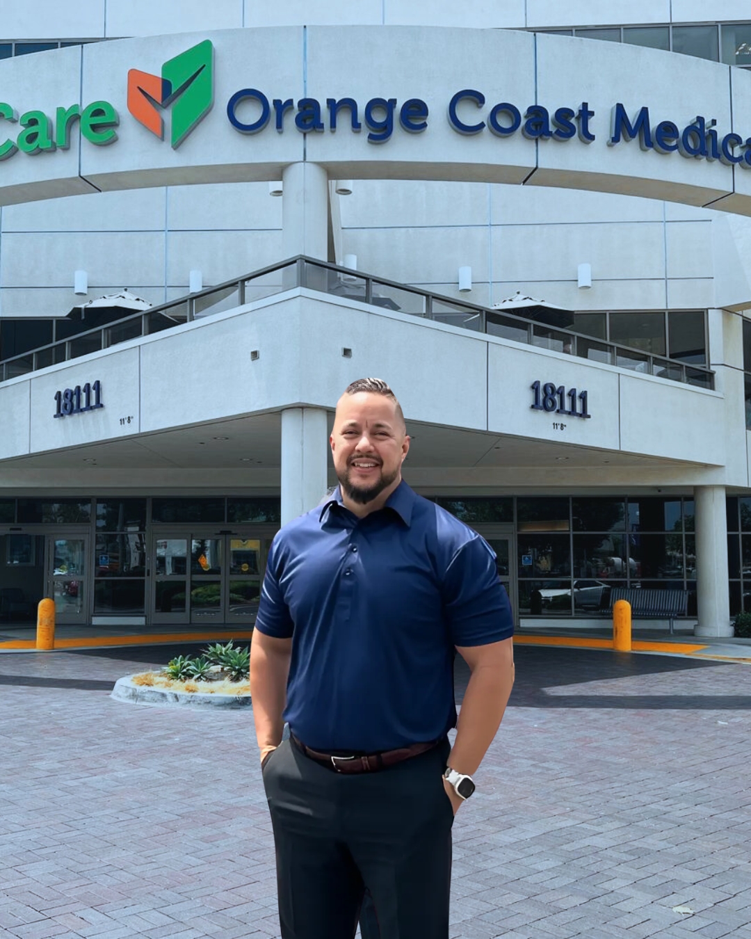 employee standing outside hospital