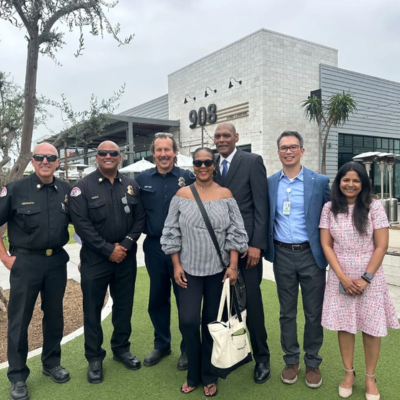 Donald Newman stands with his wife, the first responders, and Dr. Khiet Hoang and Dr. Nissi Suppogu.