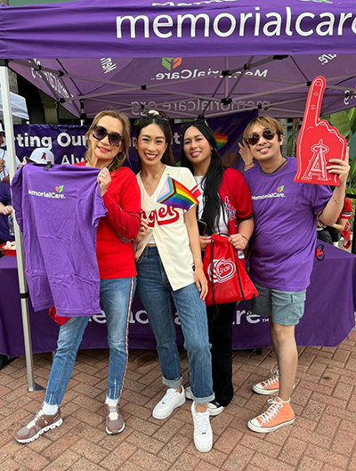 Angel fans visiting the MemorialCare resource booth at Angel Stadium Pride Night.