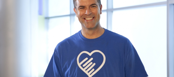 Image of healthy, happy man in a t-shirt with heart graphic