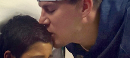 Image of Channing Tatum kissing the forehead of a young patient