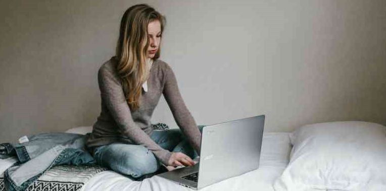 Image of a woman on a laptop
